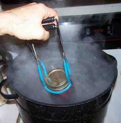 Putting jars into the water bath canner