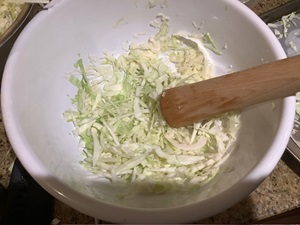 Pounding the cabbage with salt