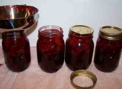 Filling the jars with jam