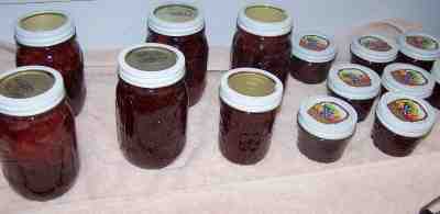 Finished 8-ounce jars of homemade strawberry jam