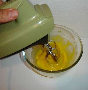 Whip the egg yolks until thickened