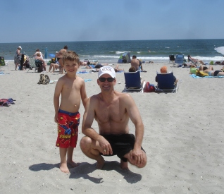 Blake and son at the beach, June 2010